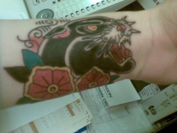 traditional panther with blossoms tattoo