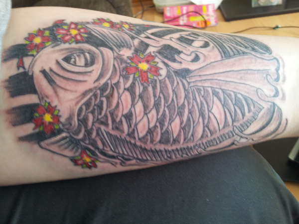 Black grey coy with bit of colour tattoo