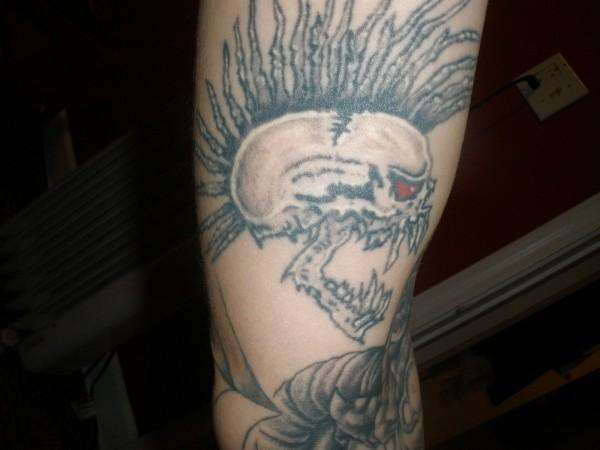 Exploited skull tattoo