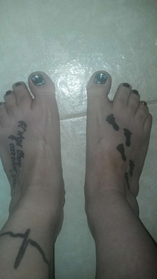 Footprints in the sand and EKG tattoo