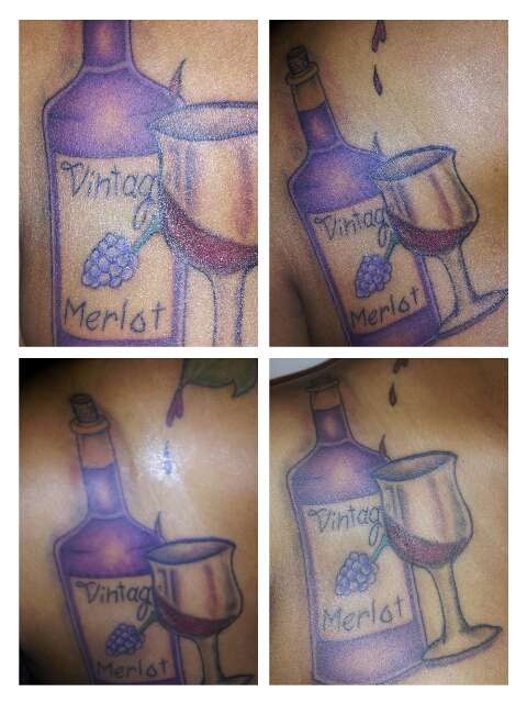 Glass of wine and wine bottle tattoo