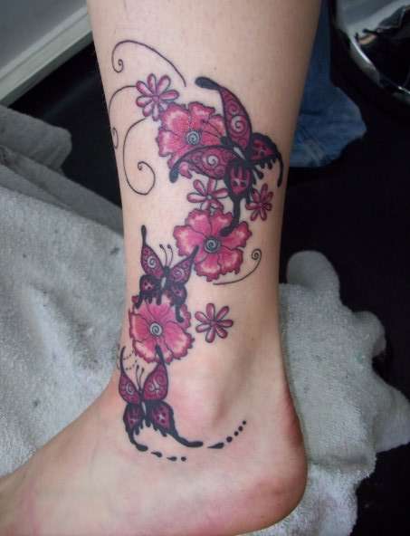Leg flowers and butterflies tattoo