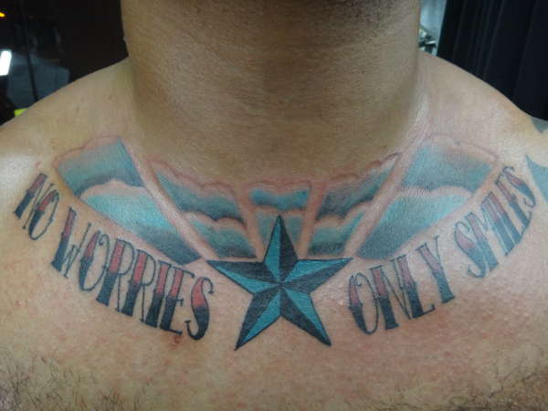 "No Worries... Only Smiles" tattoo