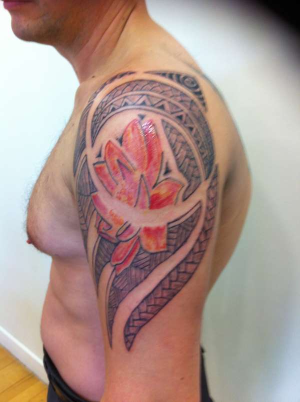 Polynesian with flower tattoo