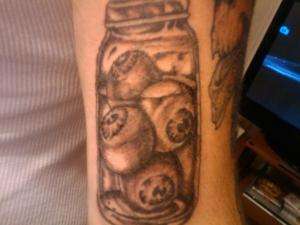 eyeballs in jar tattoo