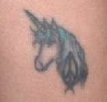 Unicorn w/ peace sign tattoo
