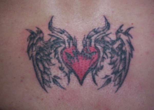 start of lower back tatt tattoo