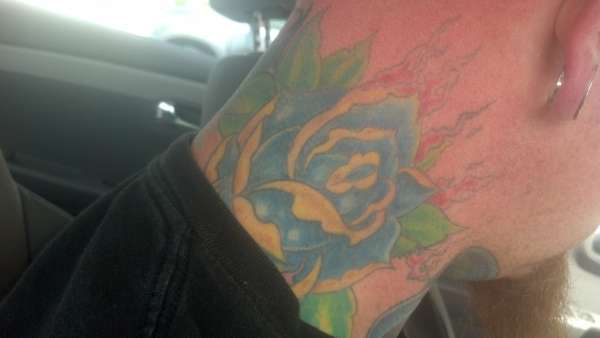 rose side of neck tattoo