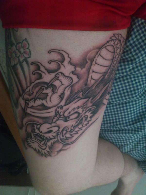 start of Japanese dragon thigh tattoo