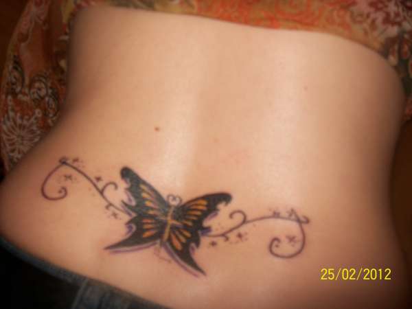 Butterfly/cross tattoo