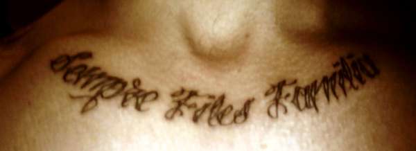 Chest  Medallion writing tattoo