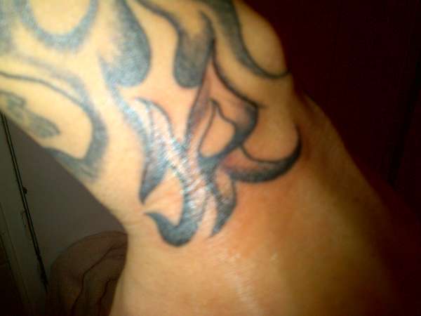 on wrist and flame tribal filler tattoo on wrist and flame tribal filler tattoo