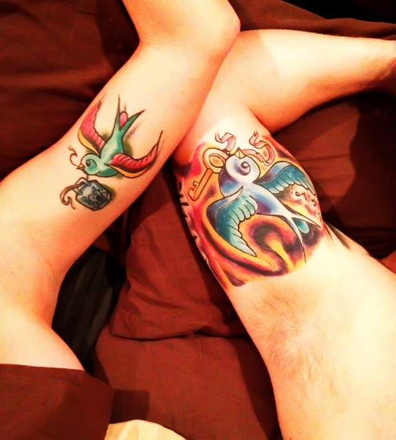 Swallow with locket tattoo