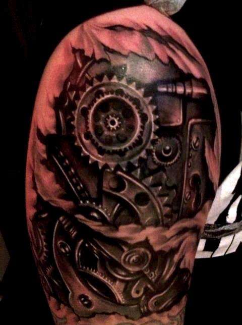 bio mechanical arm tattoo