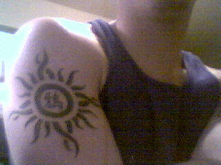 tribal sun tattoo