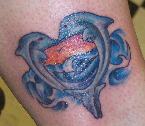 Kissing Dolphins tattoo