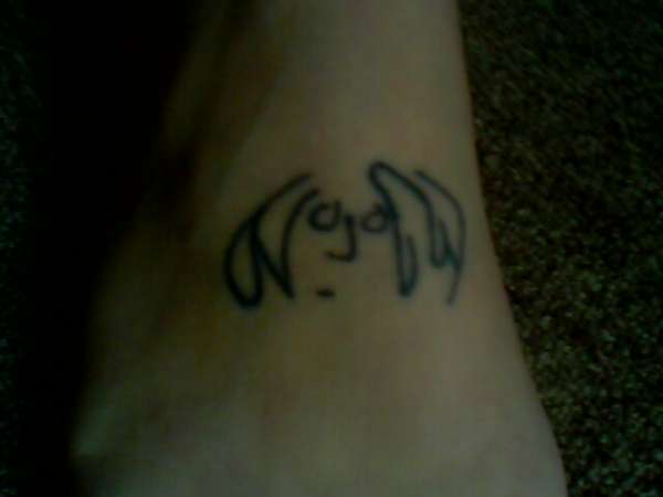 John lennon drawing on foot tattoo