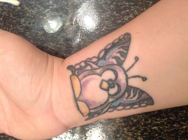 Penguin butterfly tattoo