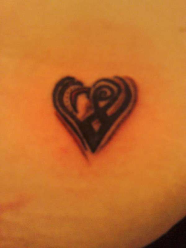 Small Tribal Style Heart tattoo