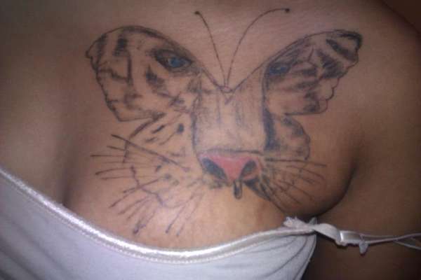 Tiger face in Butterfly outline tattoo