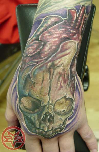 Hand skull tattoo