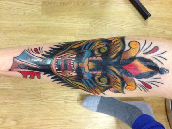 Mexican wolf on shin tattoo