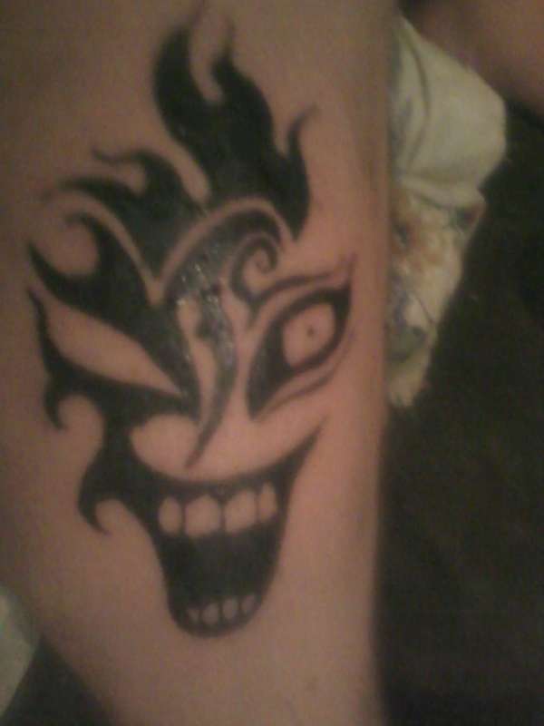 Tribal clown tattoo