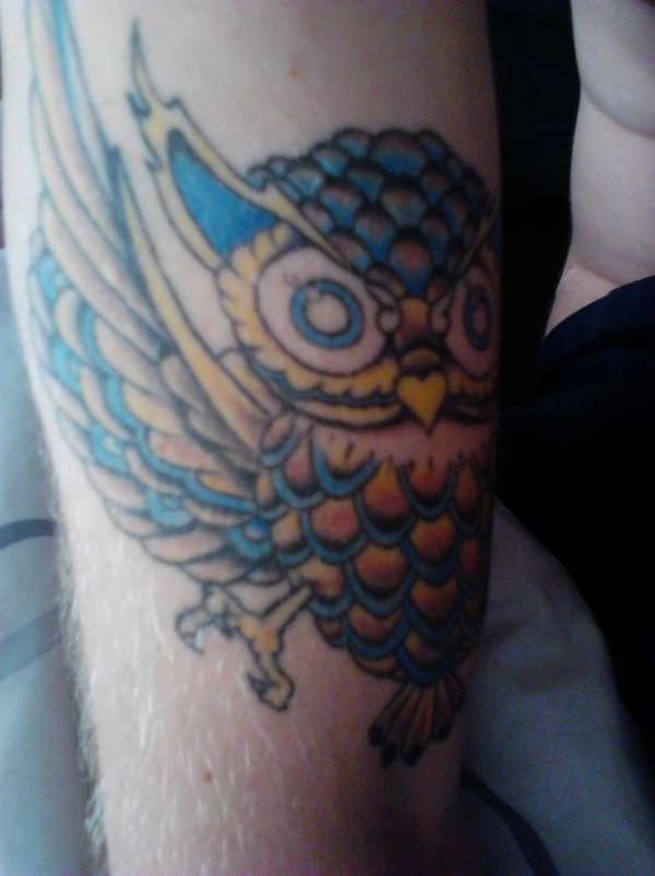 owl on right arm tattoo