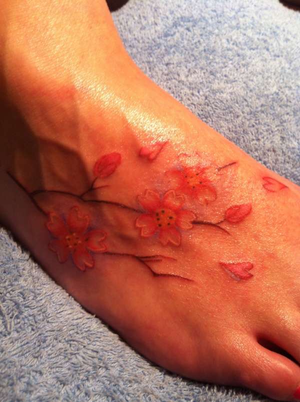 Flowers on foot tattoo