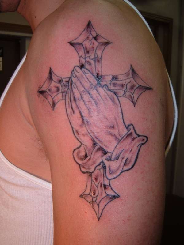 hands and cross tattoo