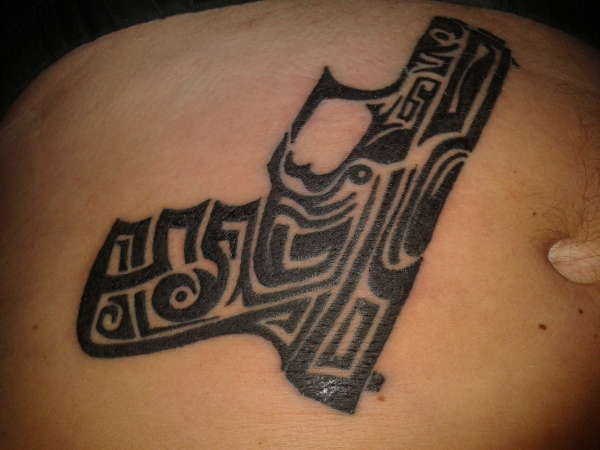 tribal gun tattoo