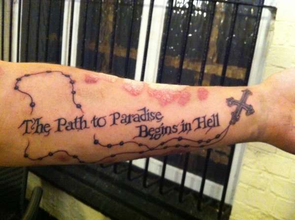 Forearm script and rosary tattoo