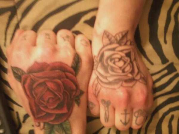 Matching traditional rose tattoo