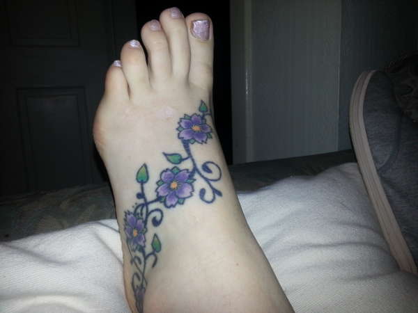 flowers on foot tattoo