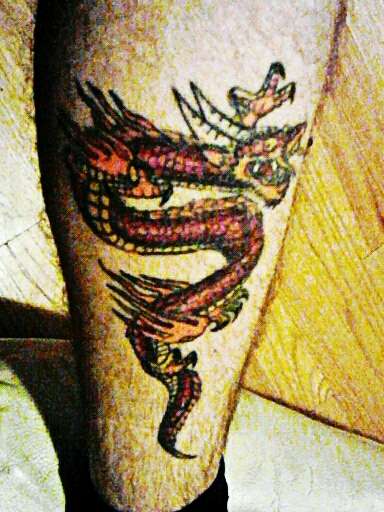My first dragon on right calf tattoo