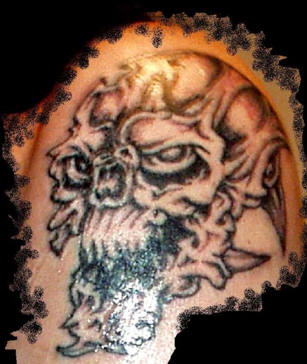 "Skull of many Faces" tattoo