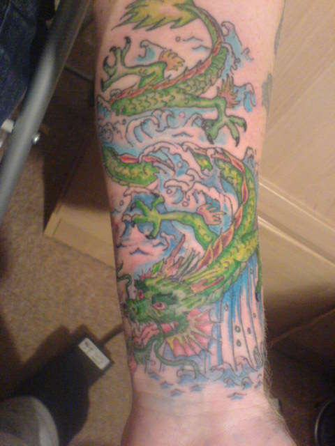 dragon on forearm tattoo