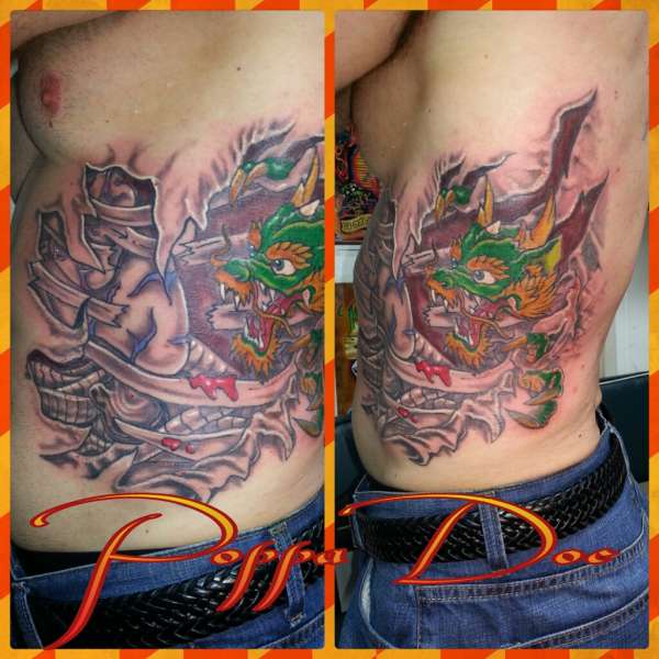 dragon tear out tattoo