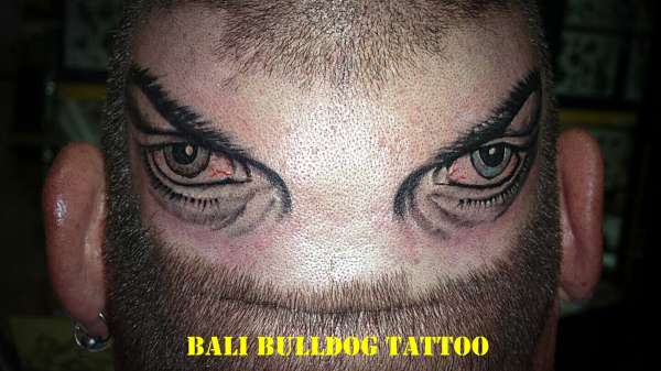 eyes on back head. tattoo