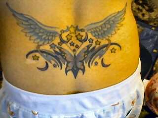 Stars, wings and butterfly tattoo