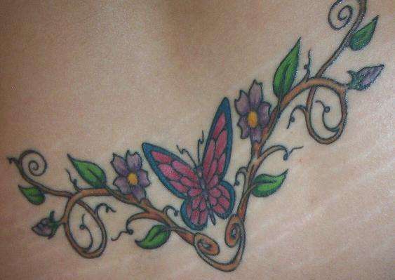 butterfly in flowers tattoo