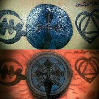 Blue blob w/ cross/Iron Man concept tattoo