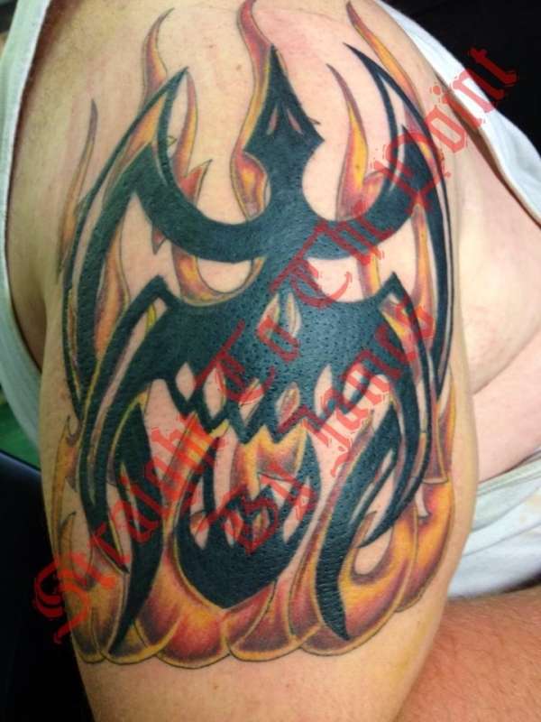 Flames and tribal skull tattoo