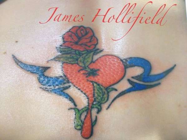 Flower and tribal tattoo