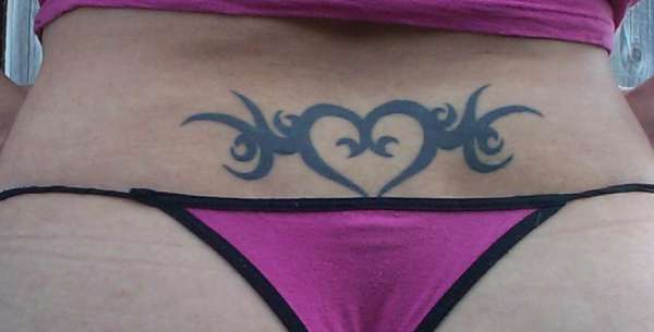 Lower back heart tattoo