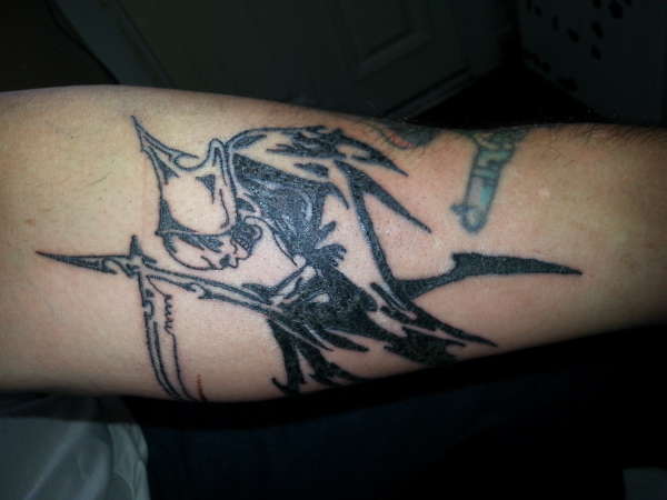 grand reaper skull looking down tattoo