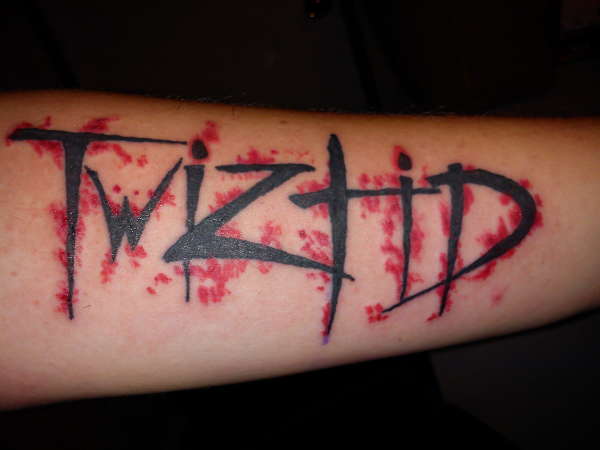 twizted by Dennis Smith tattoo