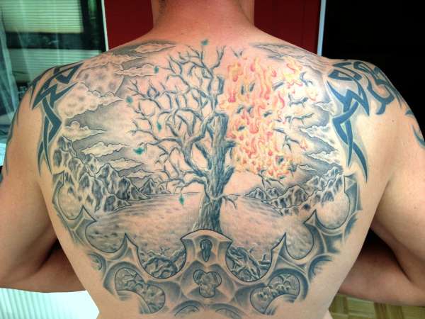 New World is done...tree with fire and a moon,hills,...blossom.. tattoo