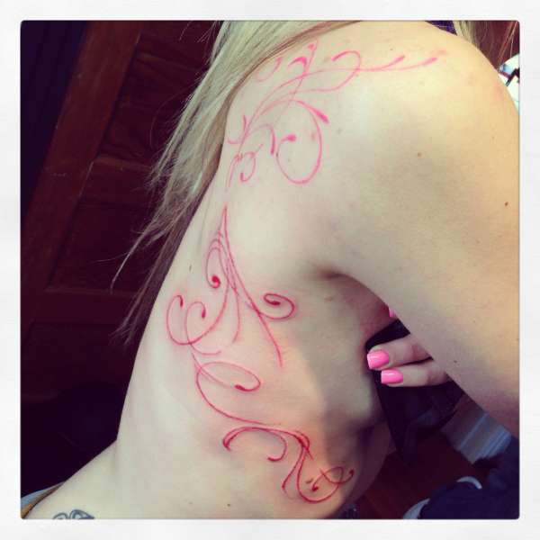 Pink uv ink tattoo