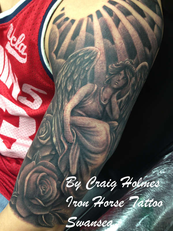 Religious angel sleeve tattoo by Craig Holmes tattoo